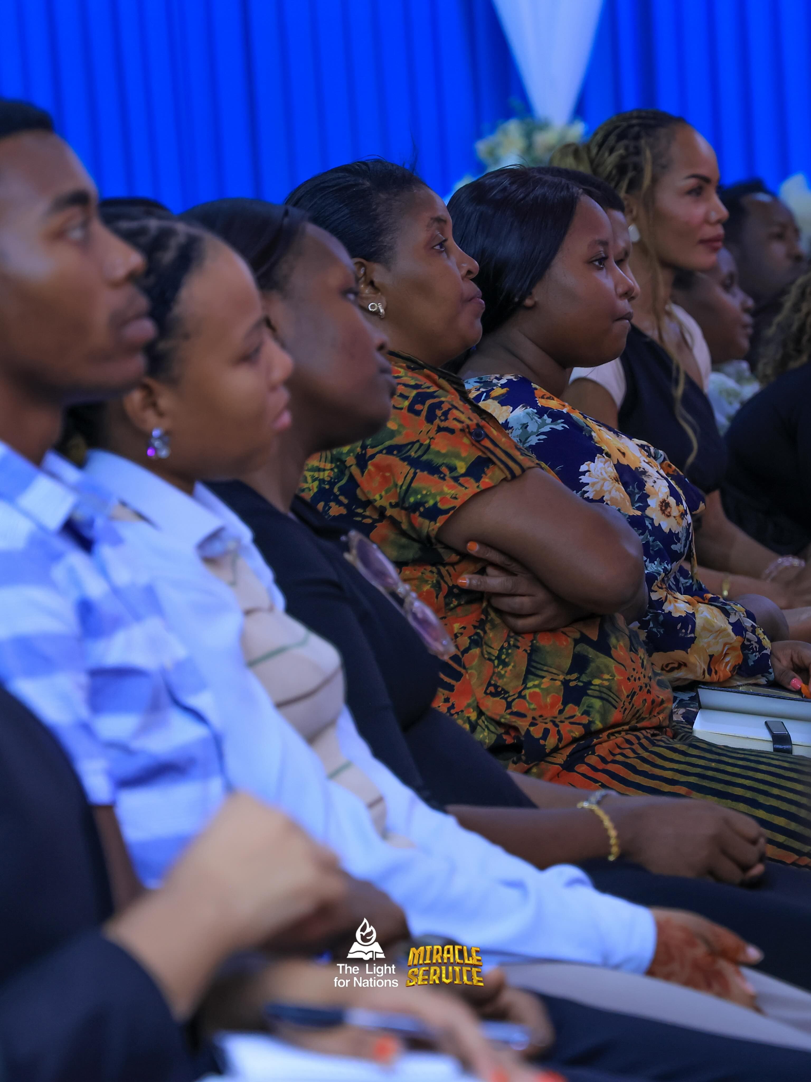 Women listening during a gathering at The Light for Nations
